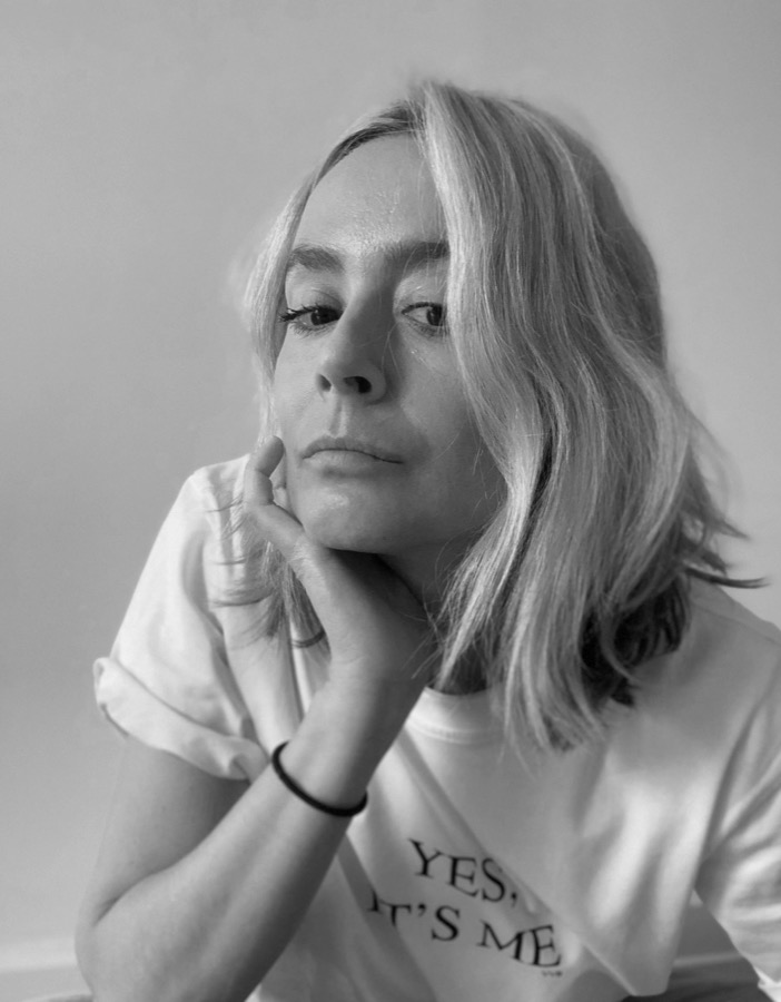 Ana Andjelic, black and white portrait, resting her chin on her hand.